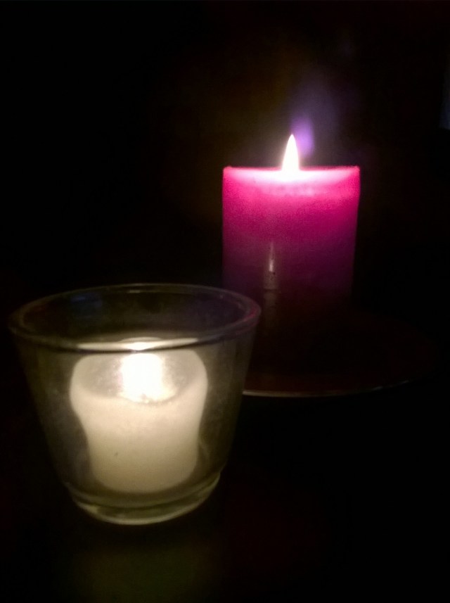 Two candles side view.