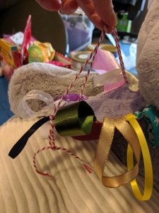 Tag rag made from reusable breast pad and ribbons Tag rag made from reusable breast pad and ribbons